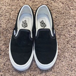 Black and white slip on vans shoes